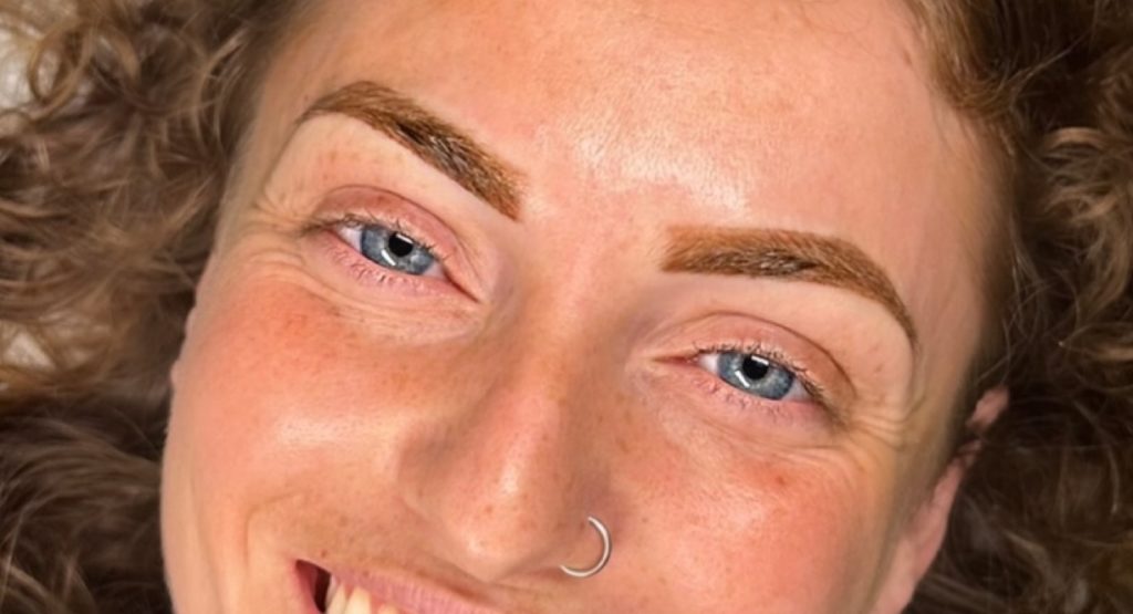 A woman with a light powder brow
