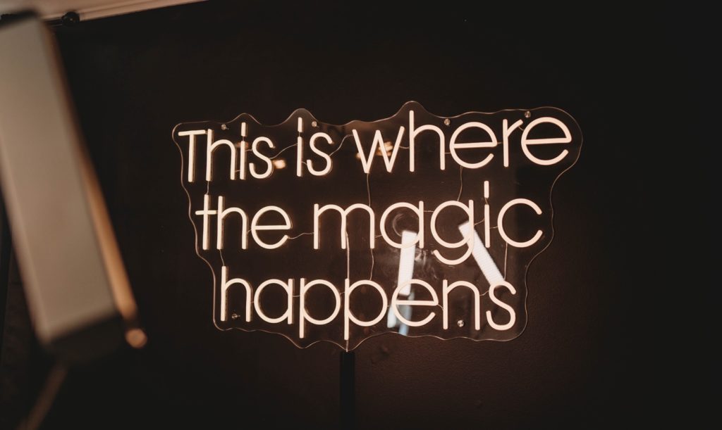 Sign that reads "This is where the magic happens"