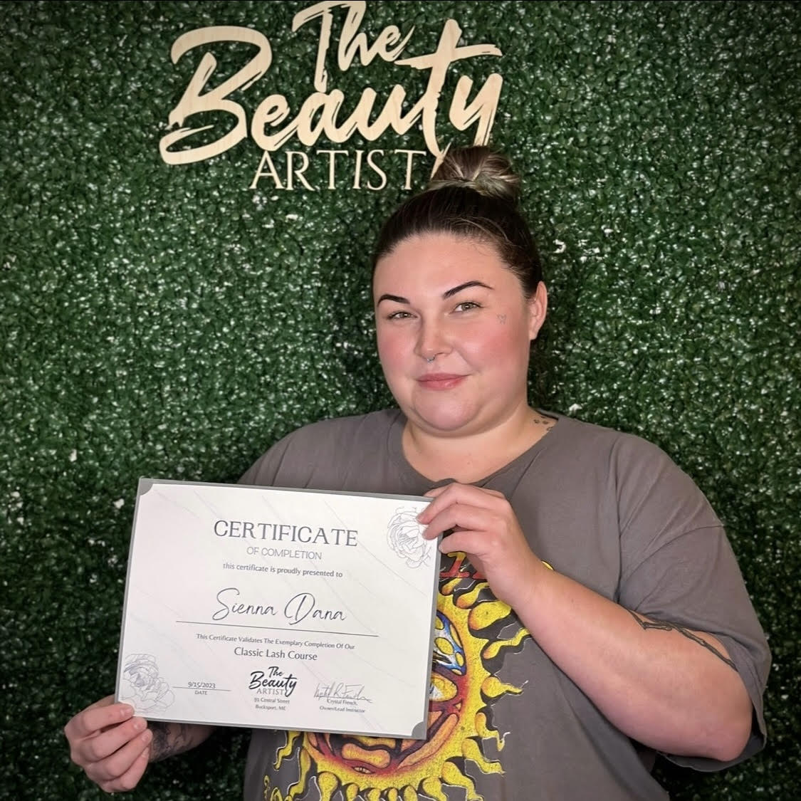 Photo of Sienna Dana holding course completion certificate